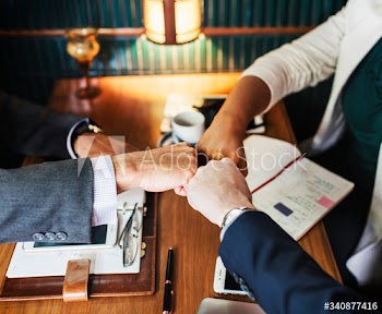 Team of business people stacking hands