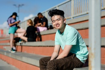 Teen boy listening to music, alone in Venice… | Free stock photo | High Resolution image