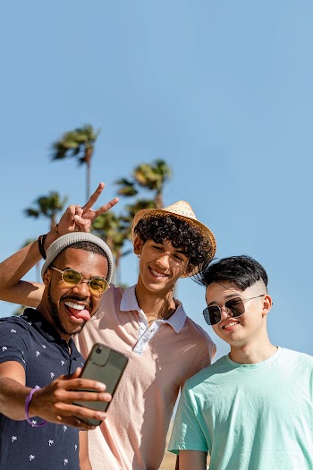 Teen boys taking selfie, playful summer in… | Free stock photo | High Resolution image
