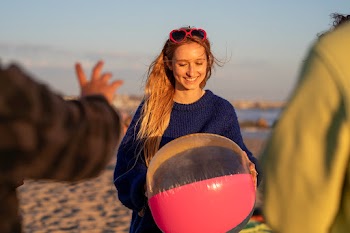 Teen girl holding beach ball, on a summer… | Free stock photo | High Resolution image