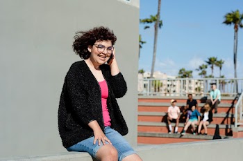 Teen girl on the phone, away from friends | Free stock photo | High Resolution image