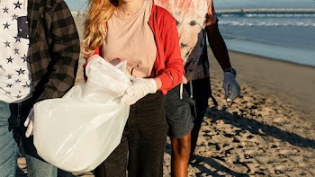 Teenagers cleaning beach, picking up trash… | Free stock photo | High Resolution image