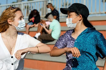 Teens elbow bump greeting in the new normal  | Free stock photo | High Resolution image