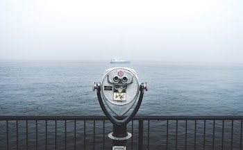 Telescope in Front of Body of Water