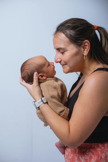 Tender Moment Between Mother and Newborn Baby