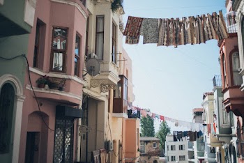 Textiles Hanging Between Houses