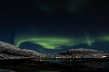 The Aurora Borealis is the magic ingredient that makes polar landscapes even more special and rare. When it appears, it might be small and almost invisible, or standing as a quiet line over the head. But it can suddenly explode in a vortex of green shadows, sometimes with some magenta edges here and there, illuminating the whole sky and the landscape around. Any cold sensation disappears.