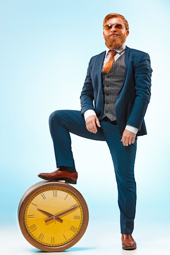 The barded man in a suit holding cane. Free Photo