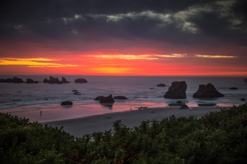 The beach at Bandon, Or. is very popular with photographers, and at sunset the beach becomes quite crowded some evenings.  I avoided the crowd and took this from the bluff overlooking the beach.     To learn how to take pictures like this, read my educational blogs at www.sharetimsphotos.com.