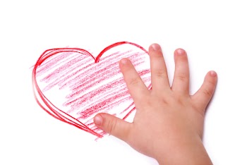 The children's hand is located in heart drawing, isolated