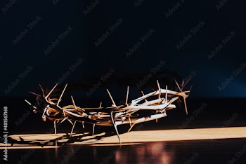 the crown of thorns of Jesus on  black background against  window light with copy space, can be used for Christian background, Easter concept