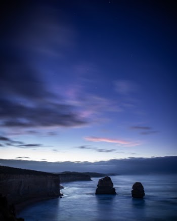 The early light of dawn illuminates the Pacific Ocean at 12 Apostles in Australia. 