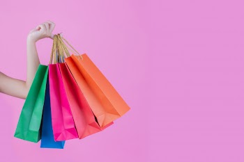 The girl holds a fashion shopping bag and beauty Free Photo
