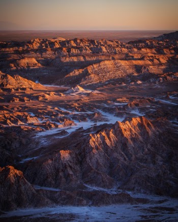 The golden light of the setting sun illuminates the Valle de la Luna in the Atacama Desert, Chile. I have long wanted to visit the Atacama and recently had the chance to do so. It is the driest place on Earth and the otherwordly landscapes look as such.