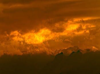 the hot summer sunset projects wonderful thoughts into the clouds on the mountain