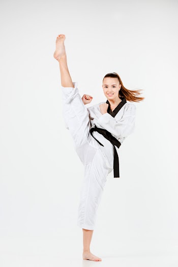 The karate woman with black belt Free Photo