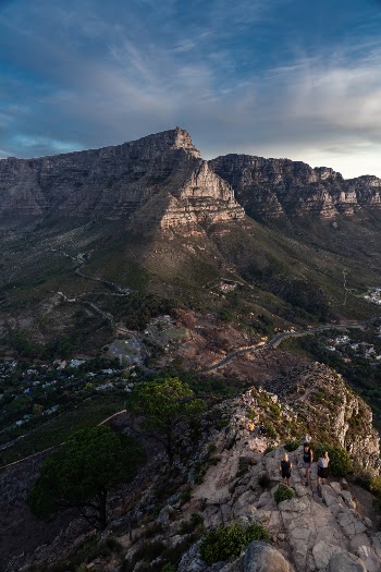 The last section of Lions Head is always the toughest. What you see in the photo is a couple of hikers starting that last section while Table Mountain stands tall at the back.