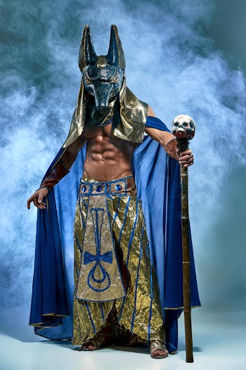 The man in the image of ancient egyptian pharaoh with a mask on his face Free Photo