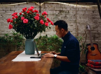 The man is working on romantic working space