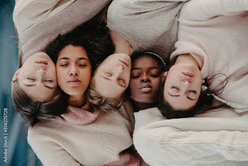The portrait of multiracial group from five women.