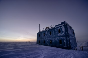 The sun is returning seen illuminating the Atmospheric Research Observatory a few weeks before it finally peaks over the horizon. 