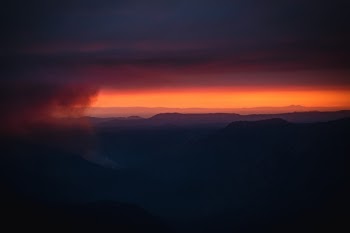 The sun sets behind a smoky haze from the beginnings of the Ferguson fire in Yosemite National Park, California. 