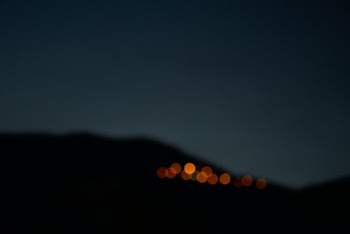 These are the lights from a TV broadcast station in the Abidar mountain. It's actually a very tall mountain but here it seems like a small hill.