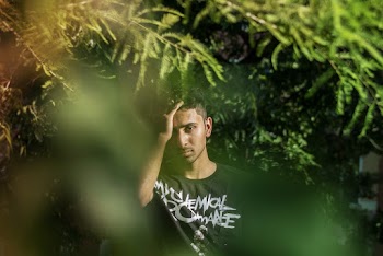 Thinking Man Behind Leaves