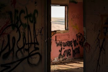 This is an abandoned house in the middle of nowhere--at least 20 miles to the nearest town (of about 500 people). it's a really creepy house and has a dark vibe but then i saw the fading sunlight highlighting this message. The word "PEYOTE" is also tagged all over the walls of this 100-year-old house, so...draw your own conclusions. 