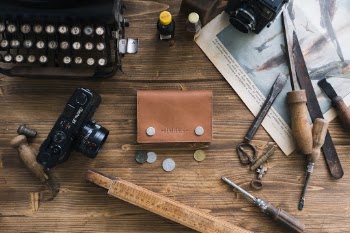 This is our small wallet, it can carry 6 cards and keep your coins, bills and more!