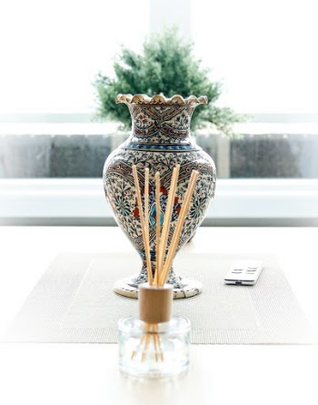 this persian vase is more than 100 years old and is now part of a very modern interior setting