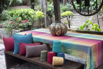 Thread Spool on Picnic Table Beside Throw Pillow