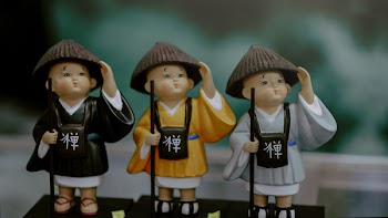 Three Assorted-color Ceramic Figurines