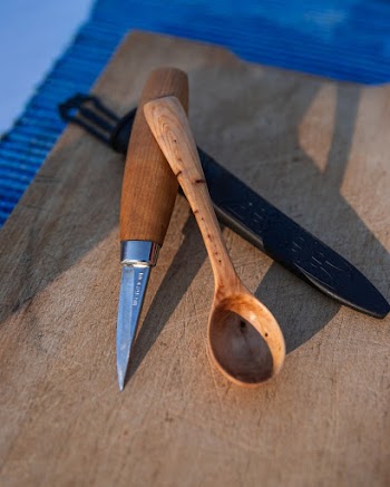 Three Assorted Hand Tools on Wooden Surface
