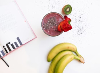Three Bananas Near A Fruit Shake