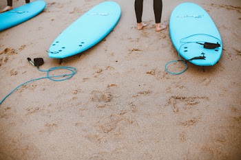 Three Blue Tow Surfboards Placed on Brown Sand