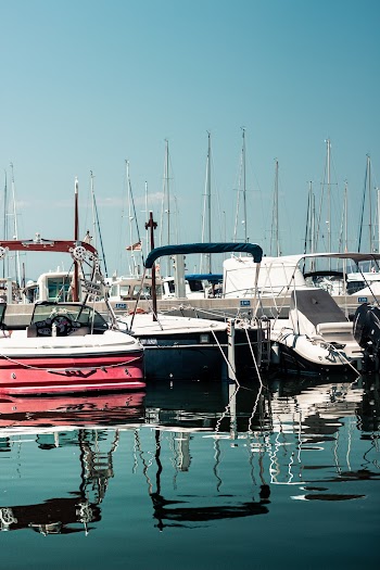 Three Boats on Body of Water
