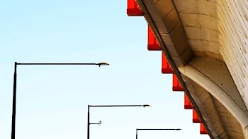 three cantilever light posts