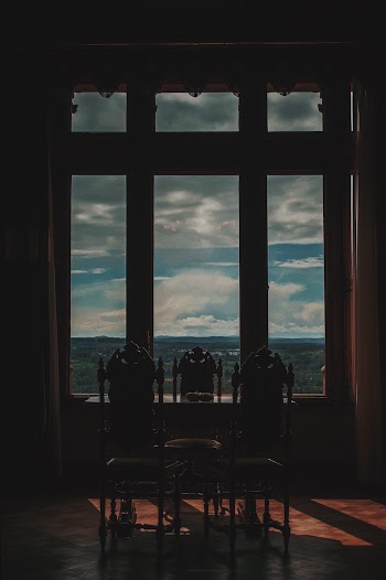 Three Chairs Beside Window
