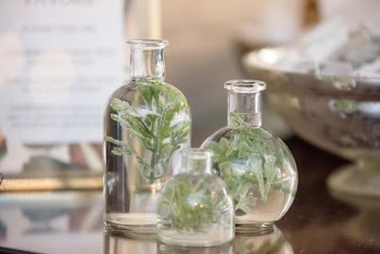 Three Clear Glass Bottles Filled With Water 