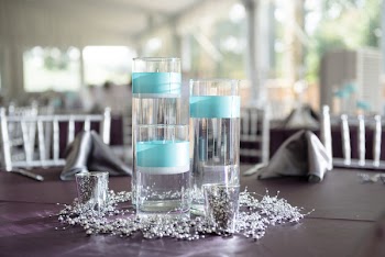 Three Clear Glass Candle Holders With Candles on Purple Surface
