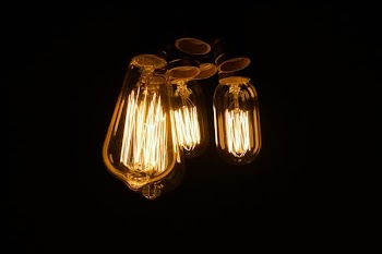 three clear light bulb