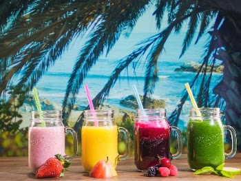 Three Drinking Glasses With Colorful Cocktails