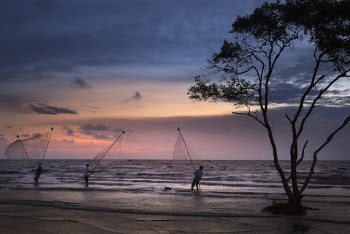 Three Fishermen fishing during Sunset