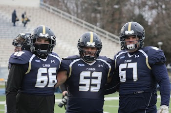 Three Football Players Having a Group Photo
