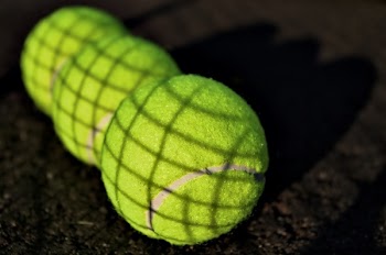 Three Green Tennis Balls