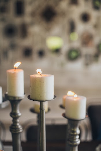 Three Lighted Pillar Candles 