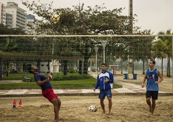 Three Man Playing Volleyball