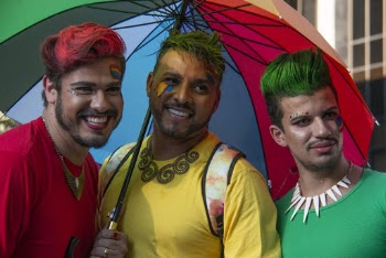 Three Man Under Multi-coloured Umbrella