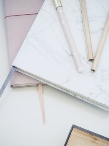Three Pens on White Book